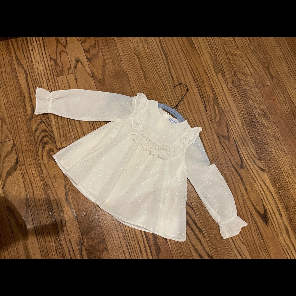 Mayoral fancy top with pin dot detail and ruffle bib.